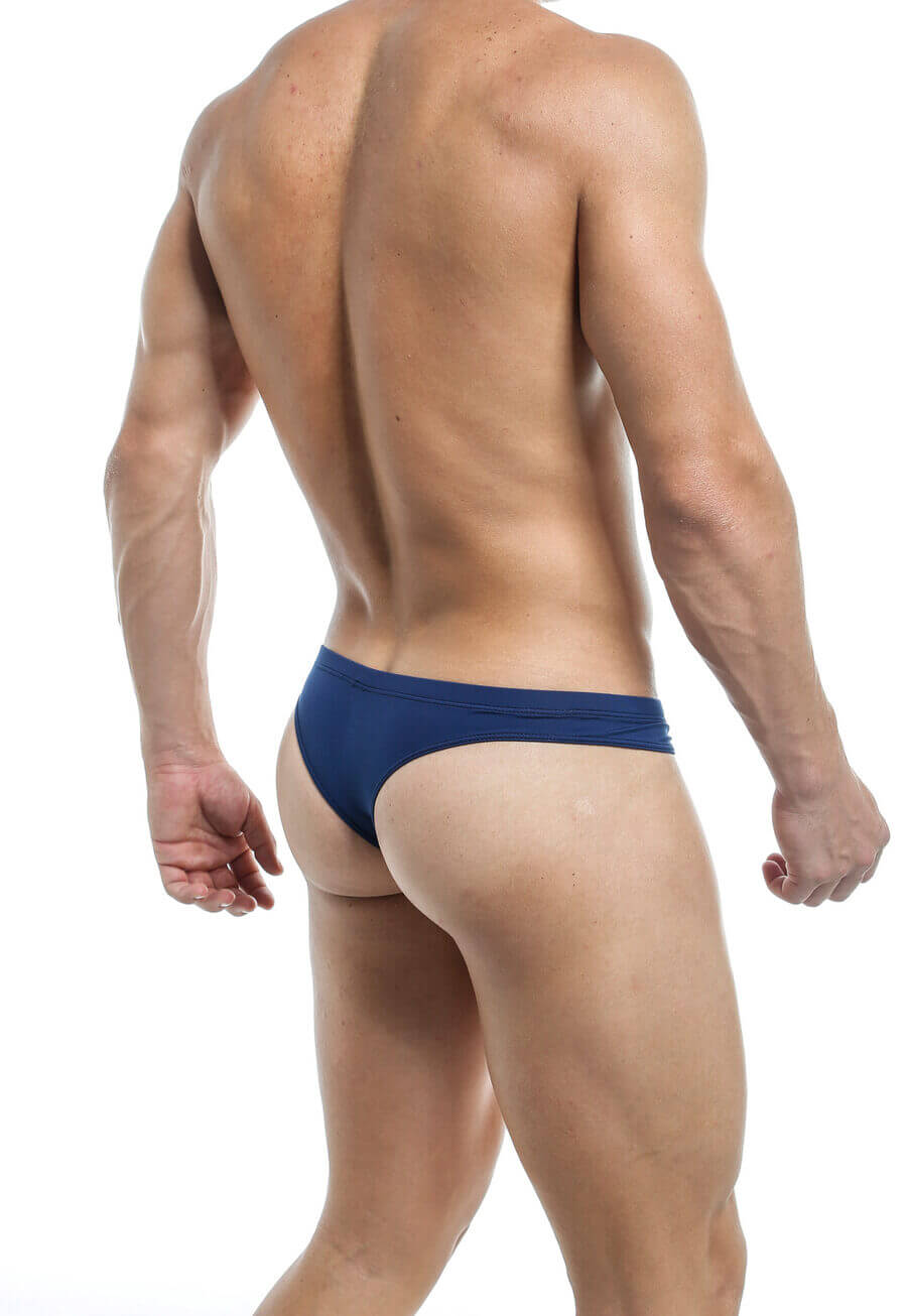 Men’s navy blue thong shown from the back, featuring a minimal coverage design with a thin waistband for a sleek and revealing fit.