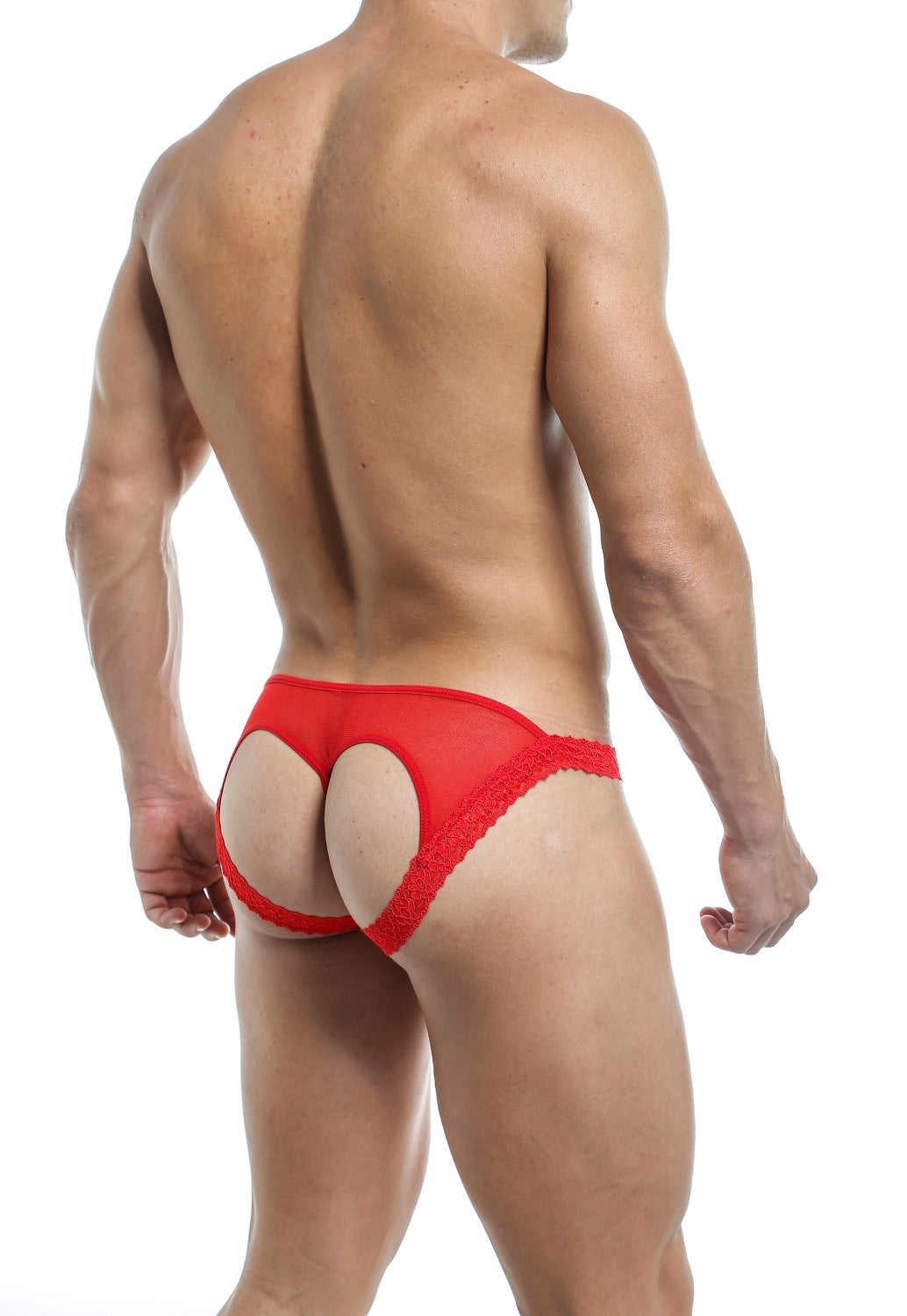 The image shows a man modeling red lace underwear with an open-back design, rear view.