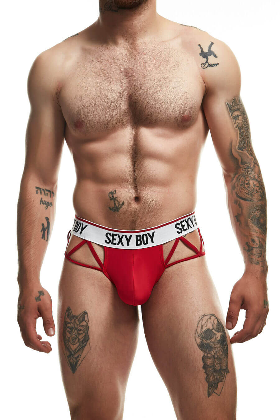 Men’s red erotic brief with white waistband printed with “SEXY BOY” in black letters, featuring provocative side cut-outs connected by thin straps for a bold and revealing look.
